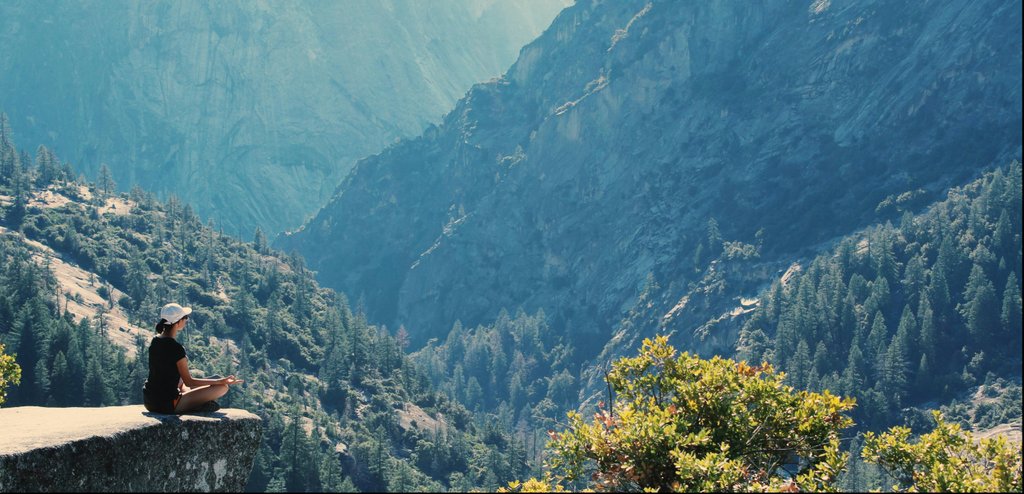 Mountain landscape with person meditating